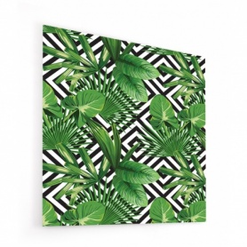 Fond de hotte avec fond géométrique noir et blanc et feuilles tropicales vertes